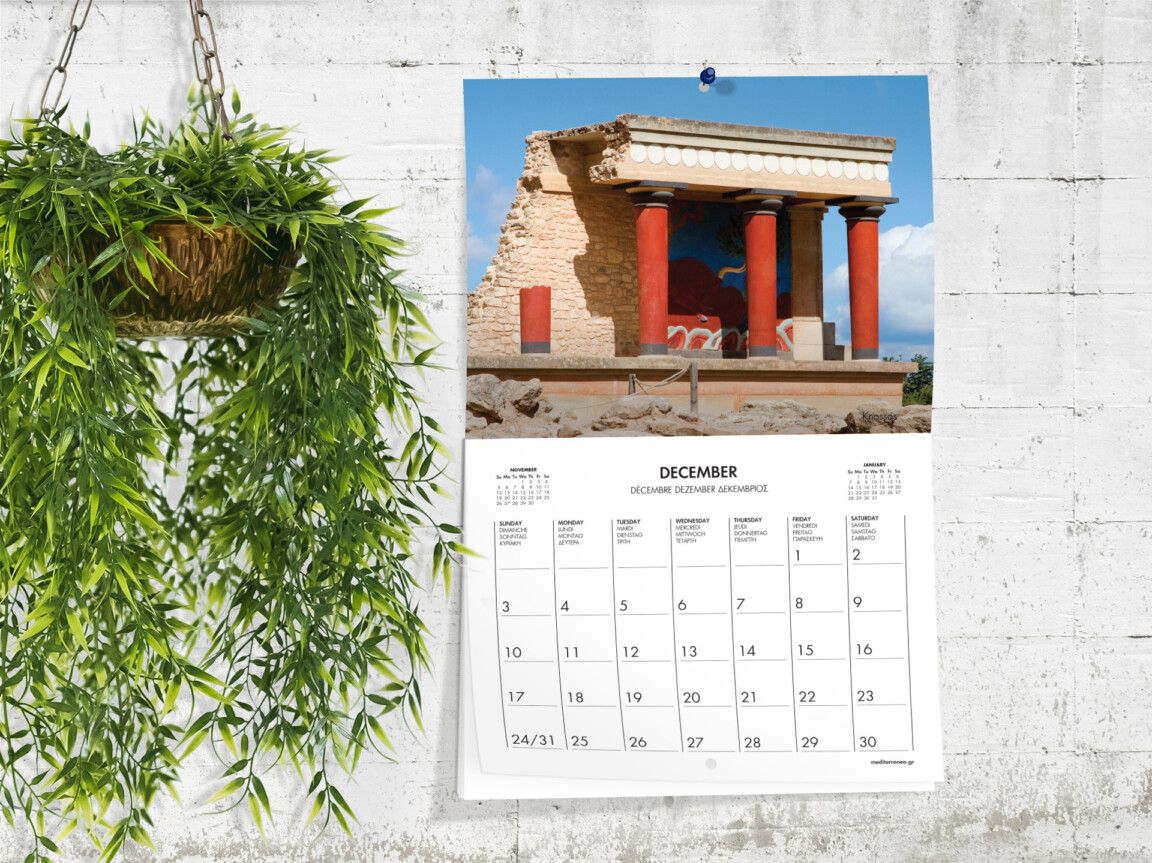 Hanging wall calendar showing December with ancient ruins photo.
