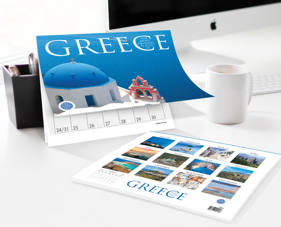 Greece-themed desk calendar on office table.