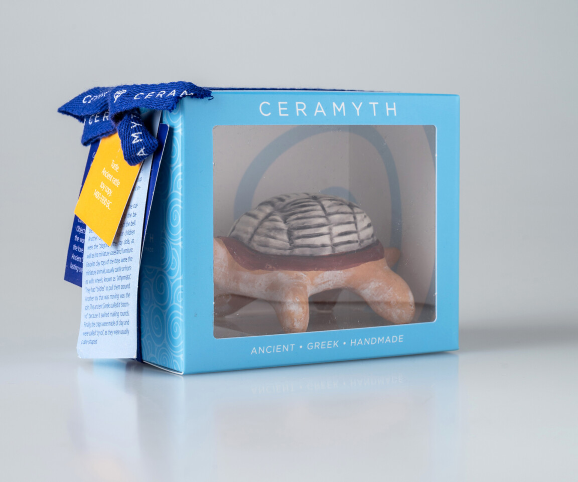 Handmade ancient Greek ceramic turtle in packaging.