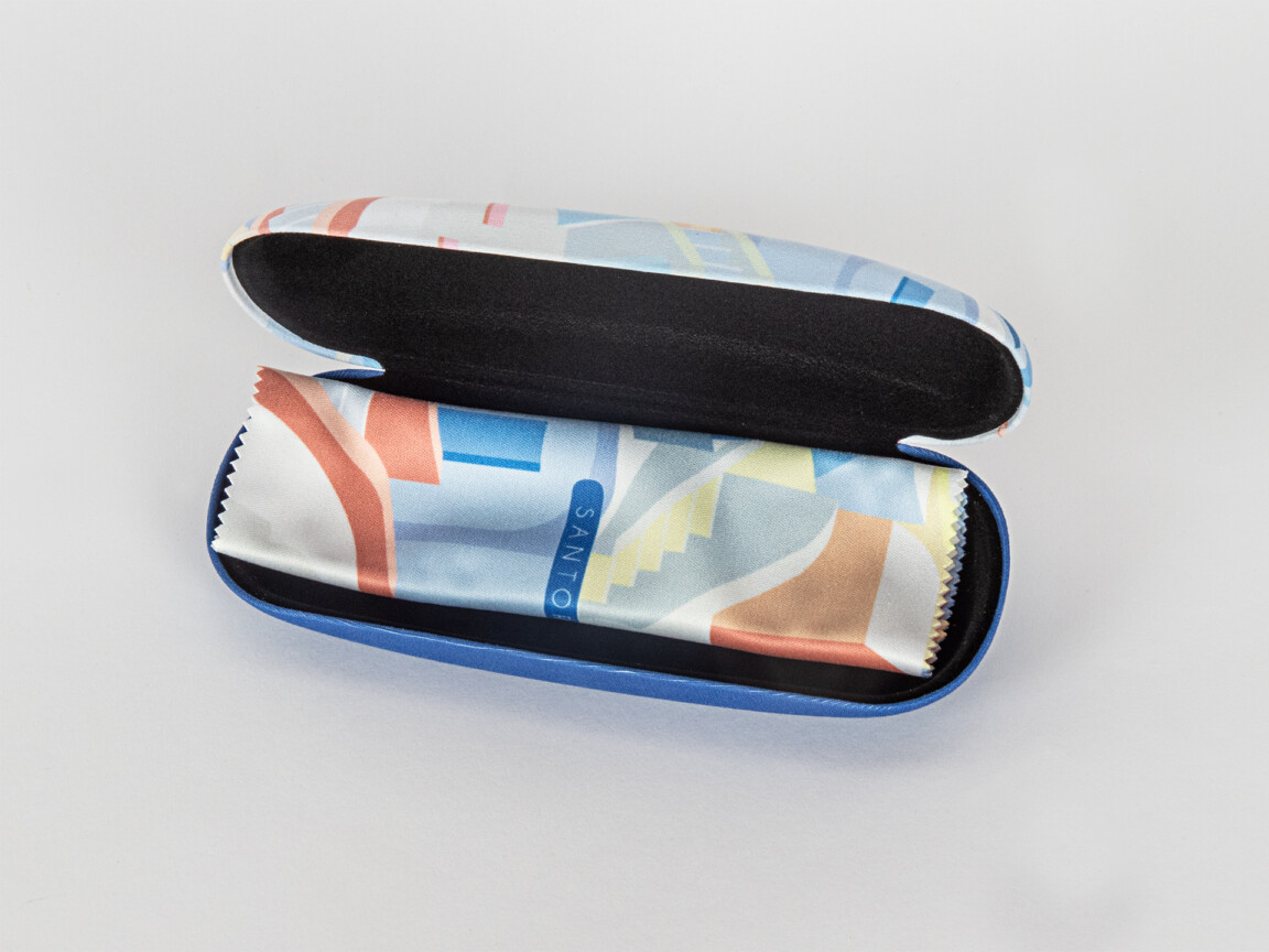 Colorful abstract-patterned eyeglasses case open.