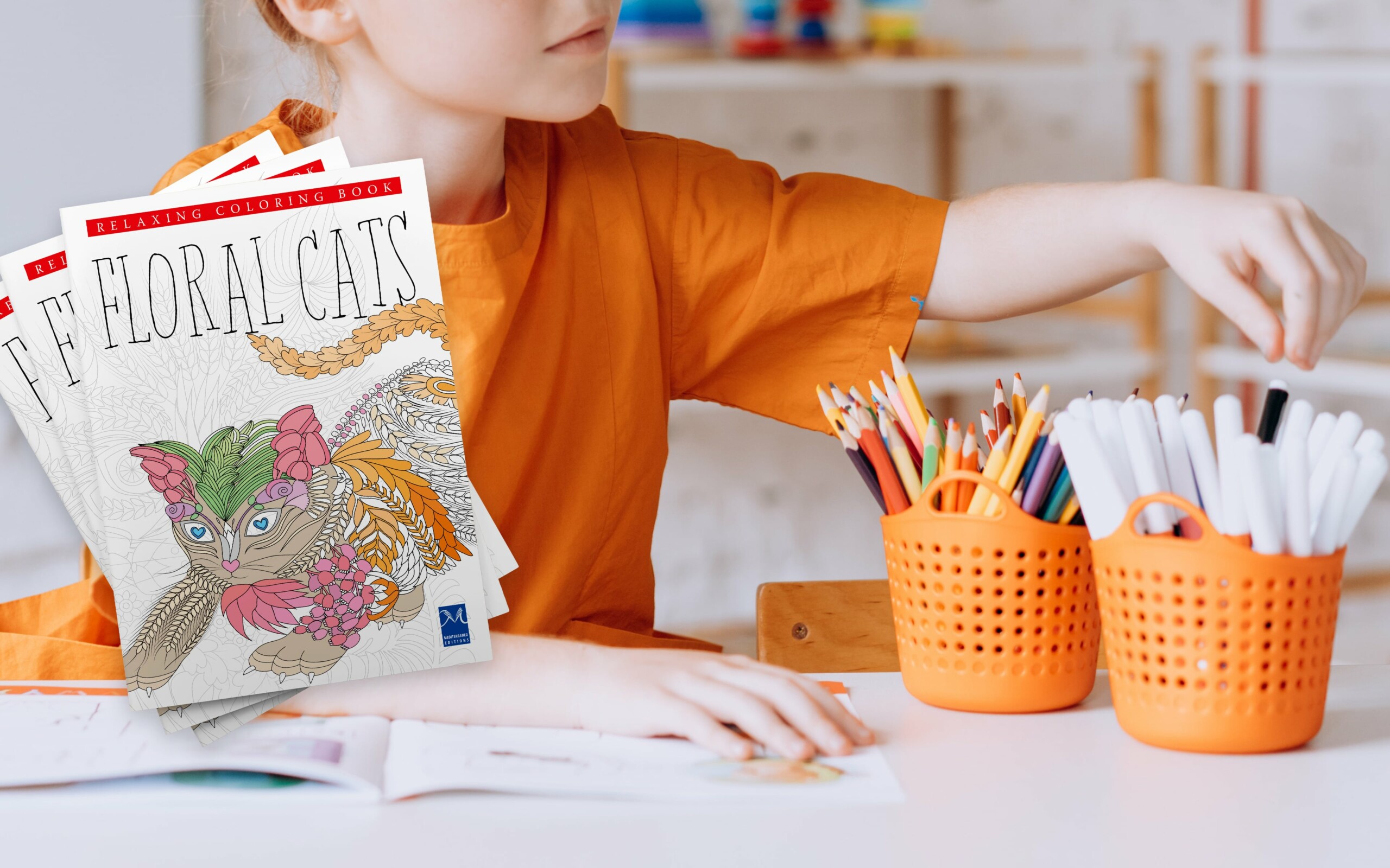 Child coloring with "Floral Cats" coloring book.