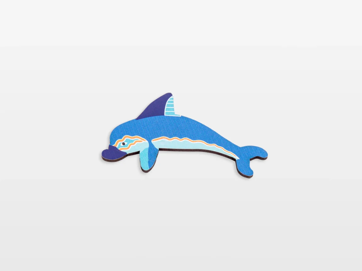 Colorful paper dolphin craft on white background.