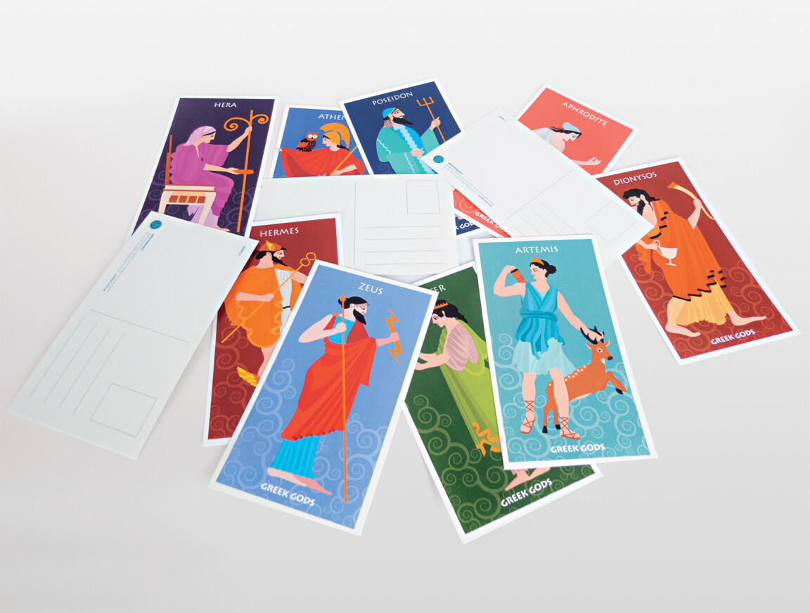 Illustrated Greek mythology postcards on table.