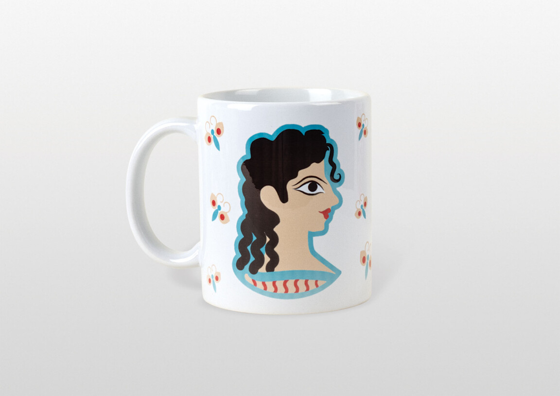 Decorative mug with illustrated woman's profile.