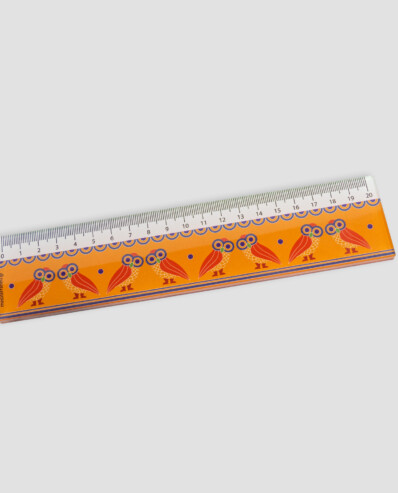 Decorative orange ruler with owl designs on white background.