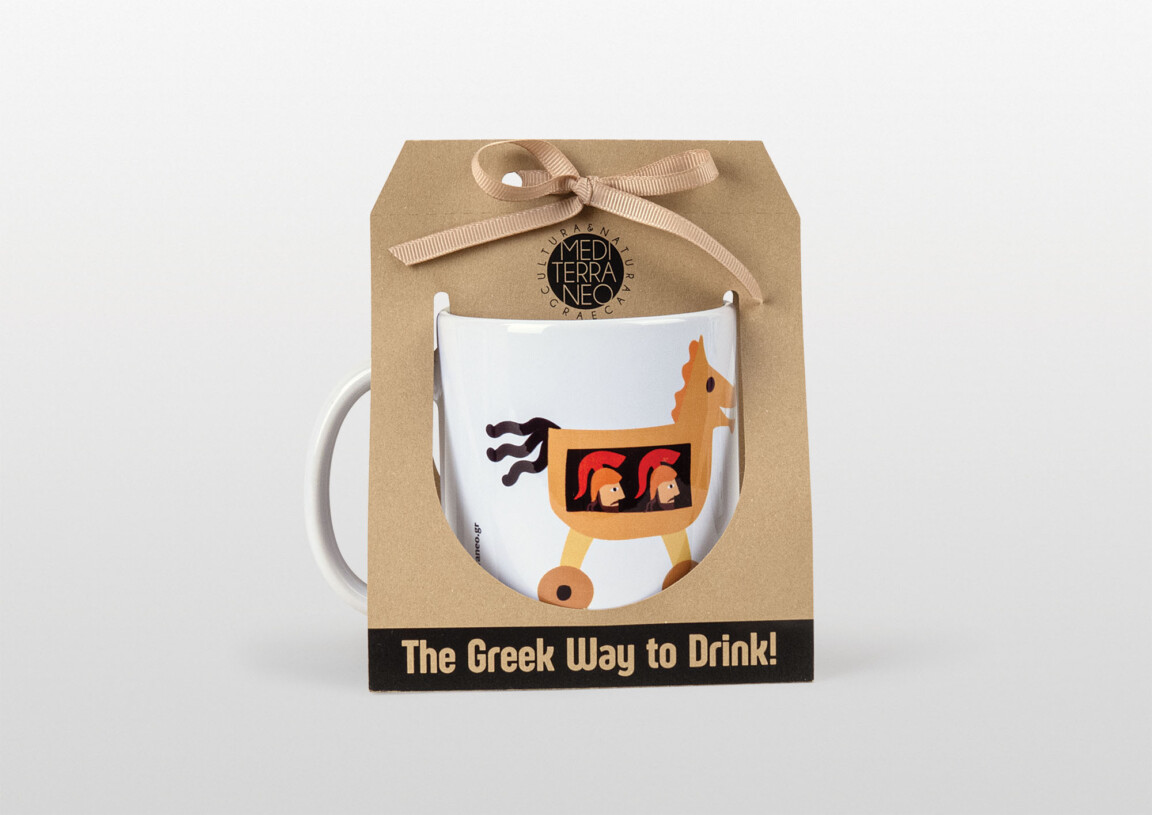 Decorative Greek-themed mug in package with slogan.